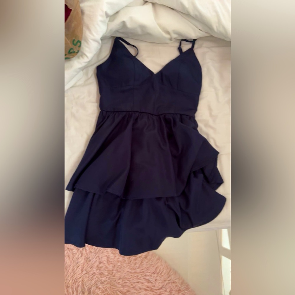 This dress is was bought in vegas it’s a dark navy blue and size xs